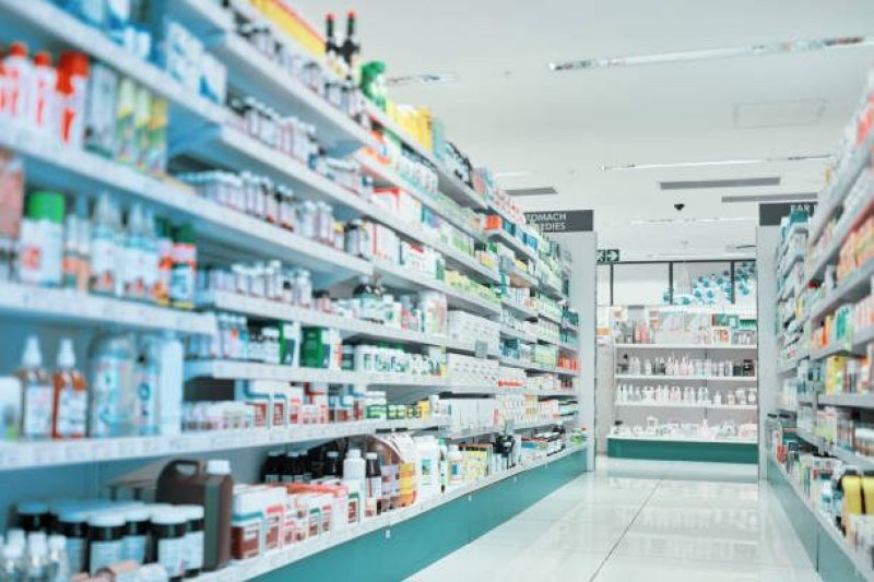 Cropped shot of fully stocked shelves in an aisle of a pharmacy
